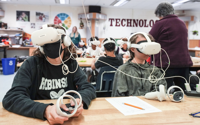 students wearing VR goggles in classroom